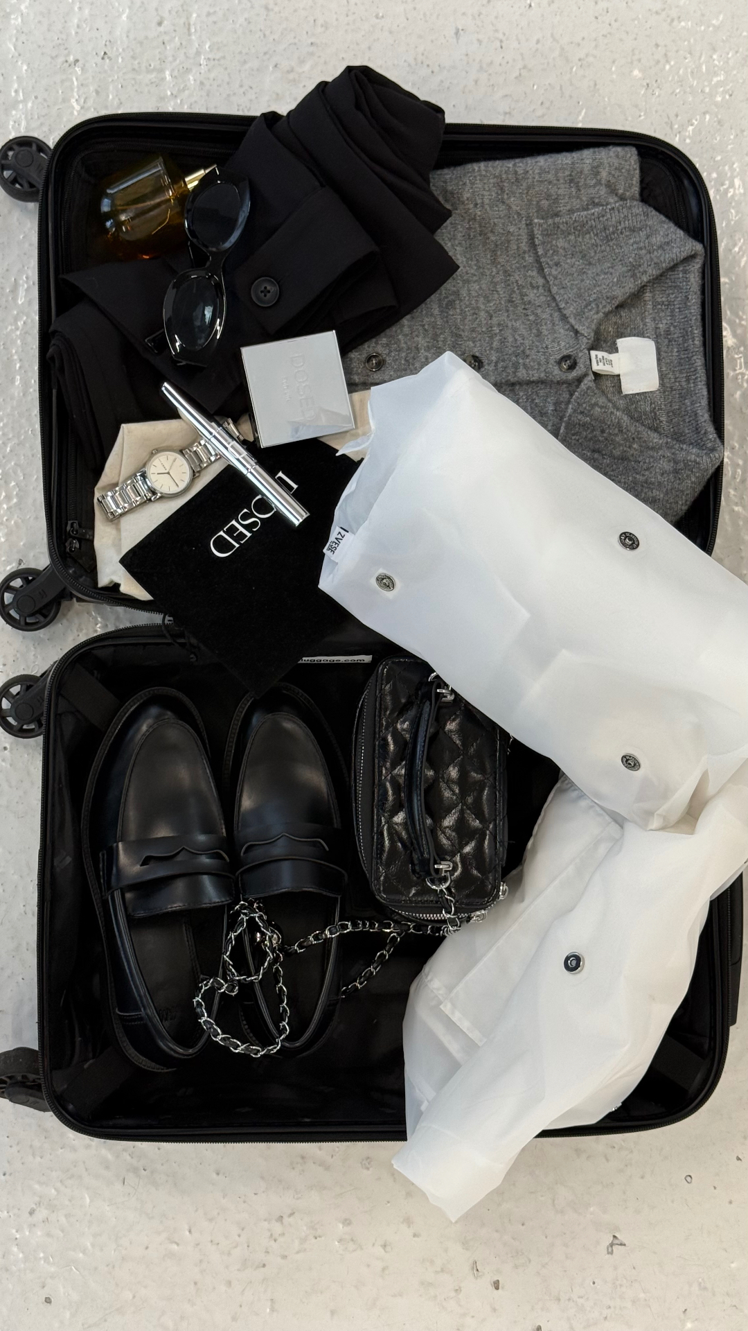 Overhead view of ZVESE bag tucked into a carry-on with travel essentials