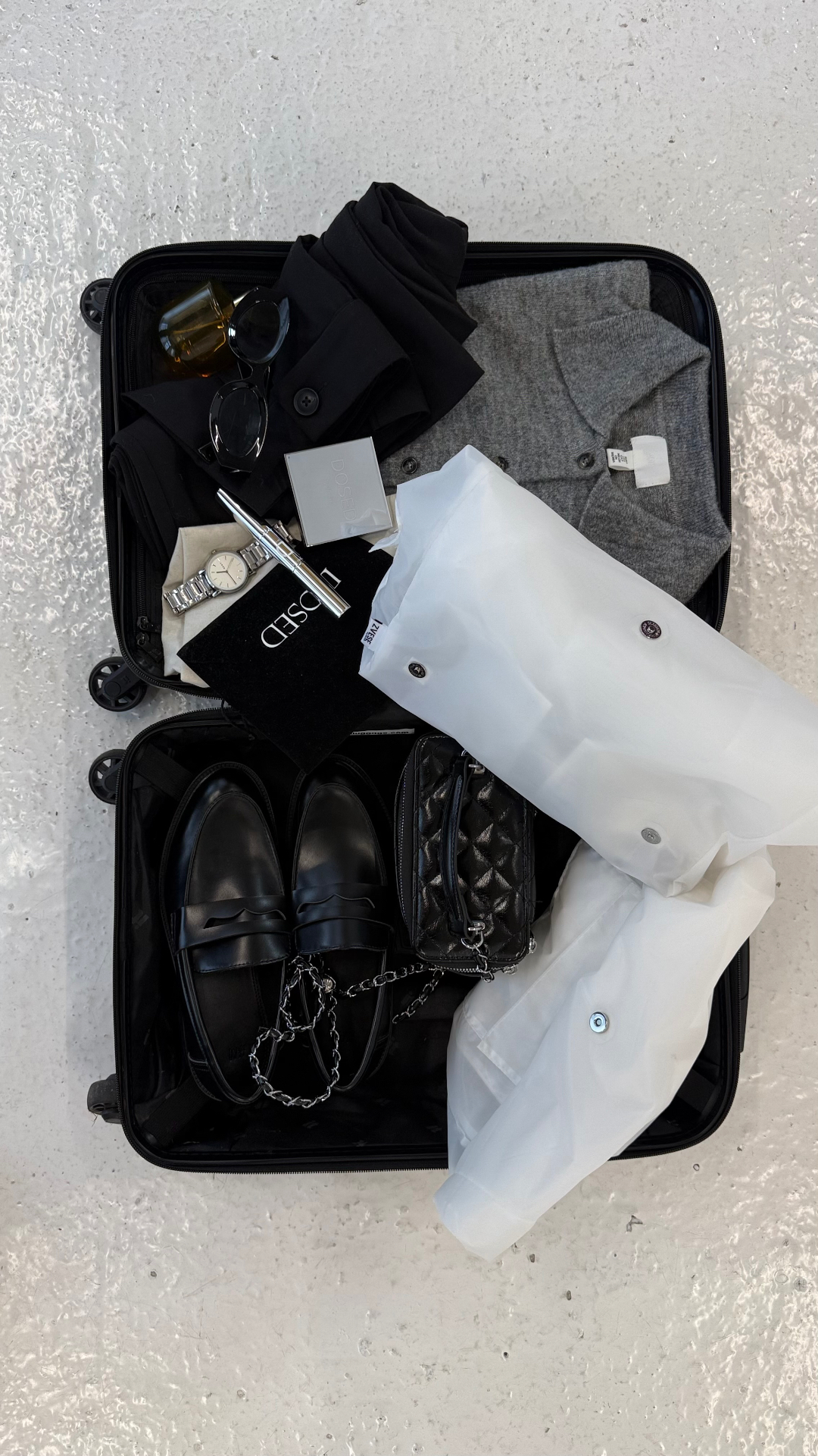 ZVESE bag packed inside an open carry-on suitcase with loafers and cashmere